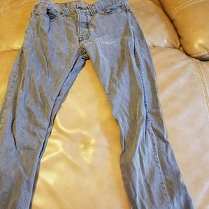 A pair of distressed straight leg jeans size 30